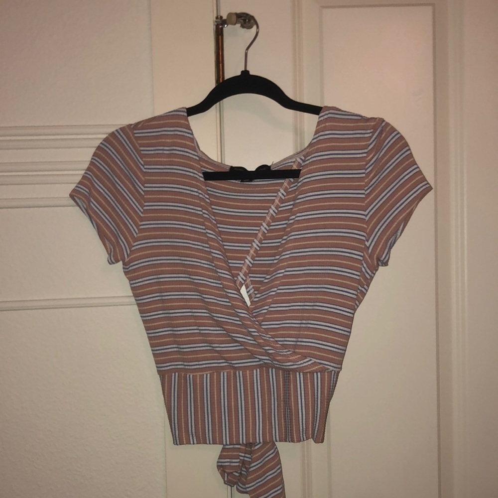 Stripped shirt from Nordstrom that urs in the back. Size Medium.
